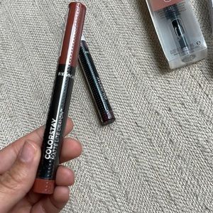Lip crayon - clear the air (brownish)  , lip wine (plumish color) .